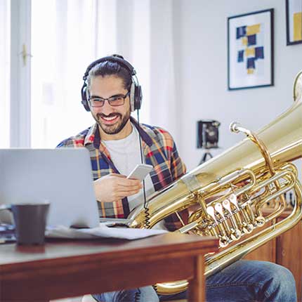 learning to play the tuba online with practicing musician