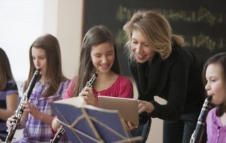 children have fun learning to play music, homeschool and in class