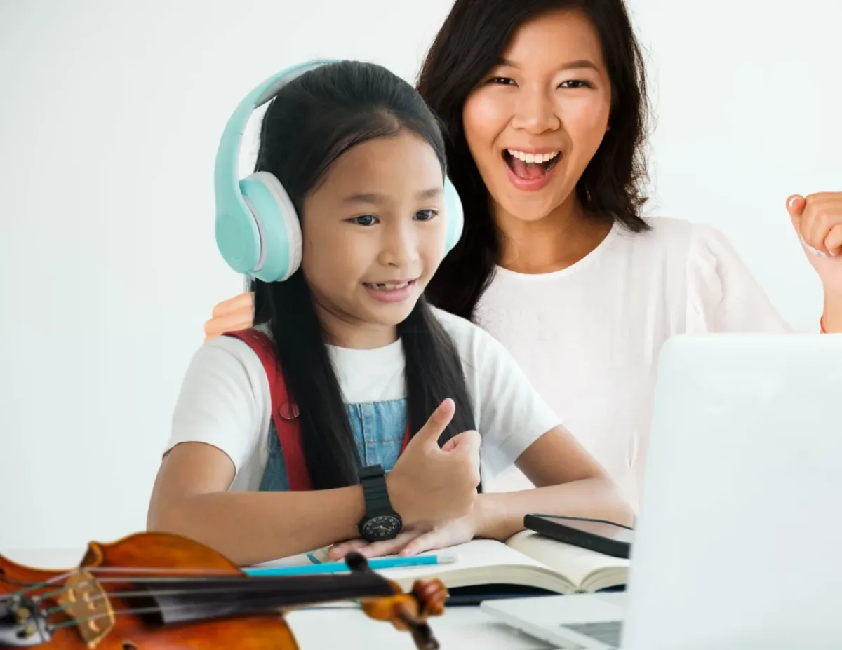 A parent and child learning together at home A parent and child learning together at home