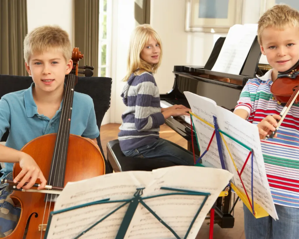 Family playing music together in evening, Structuring Homeschool Music Lessons