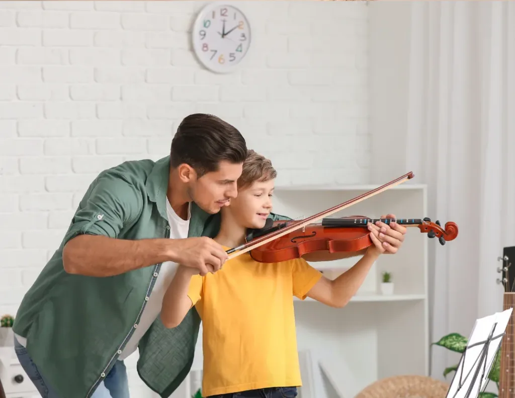 parent helping child with music lessons