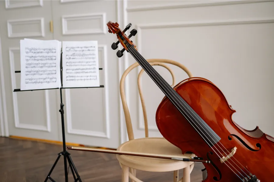 cello with music stand and sheet music,and cello bow