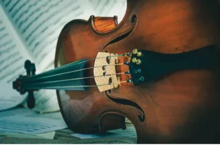 a cello showing that the strings need to be changed