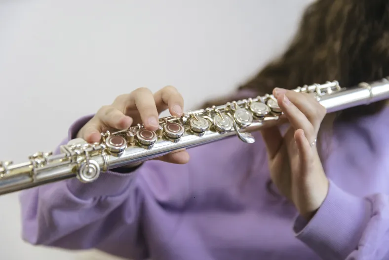 Child playing a starter flute