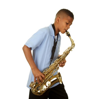 Boy practicing saxophone with Practicing Musician