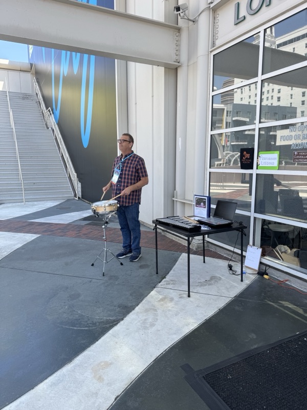 Instructor Joel demonstrating drumming at NAYDO 2026